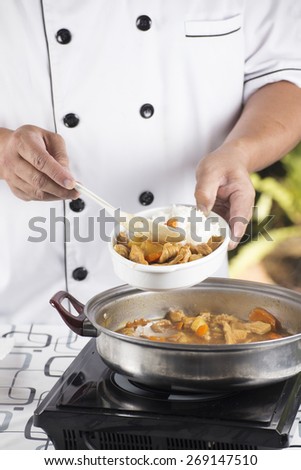 Chef shovel Japanese pork curry with steam rice / cooking Japanese pork curry paste concept