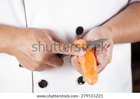 Chef is peeling carrots / cooking Japanese pork curry paste concept