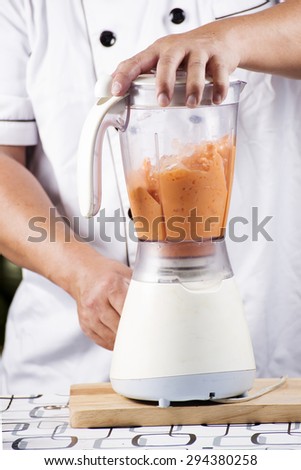 Chef making Thai Tea smoothie with blender