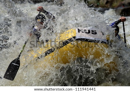 LIPNO, CZECH REPUBLIC - AUG 30: Wild water around russian raft is very cold and danger! Head to head raft 4 competition on European Championship in rafting on august 30, 2012 in Czech Republic