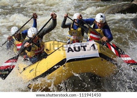 LIPNO, CZECH REPUBLIC - AUG 30: Paddling, thinking, cooperation and strenght, that is  head to head raft 4 competition on European Championship in rafting on august 30, 2012 in Czech Republic