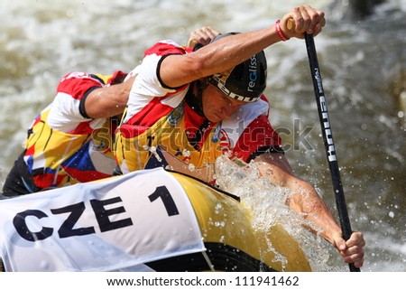 LIPNO, CZECH REPUBLIC - AUG 30: Effort of this rafter win gold medal for Czech Republic in head to head raft 4 competition on European Championship in rafting on august 30, 2012 in Czech Republic