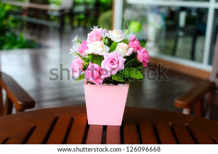 The artificial roses in the vase
