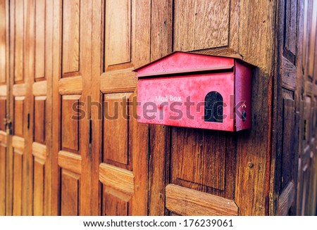Vintage red mail box on the wood background