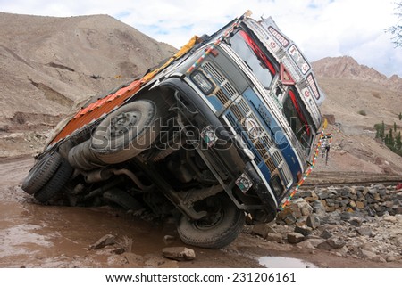 KASHMIR, INDIA - CIRCA AUGUST 2011: Wrecked Indian truck caught in landslide in the Himalaya mountains