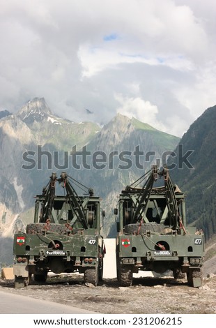 KASHMIR, INDIA - CIRCA JUNE 2012: Indian army recovery trucks high in the Himalaya mountains