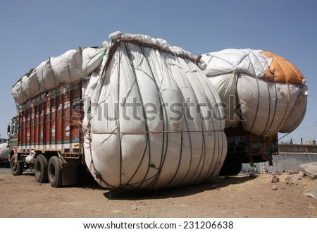 RAJASTHAN, INDIA - CIRCA 2011: Heavily overloaded truck carrying cotton crop, Kota, Rajasthan, India