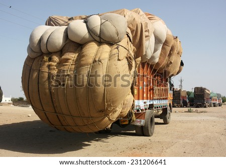 RAJASTHAN, INDIA - CIRCA 2011: Heavily overloaded truck carrying cotton crop, Kota, Rajasthan, India