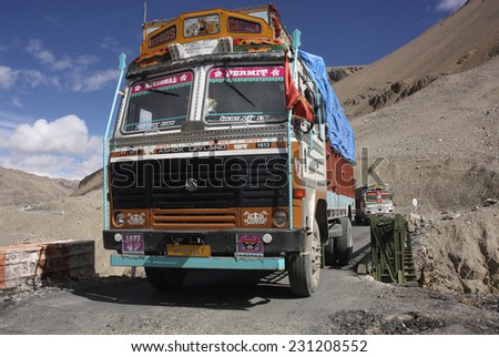 LADAKH, INDIA - CIRCA AUGUST 2011: Indian truck crosses bridge on the hazardous Manali-Leh road high in the Himalaya mountains