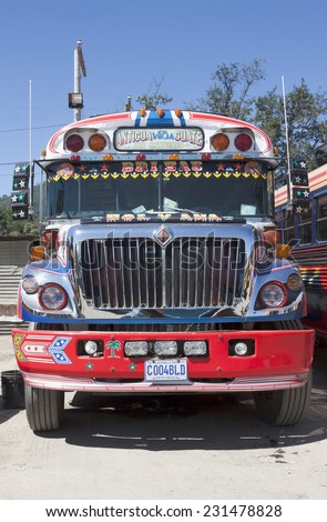 ANTIGUA, GUATEMALA - CIRCA OCTOBER 2012: Decorated local bus (chicken bus) at city bus station