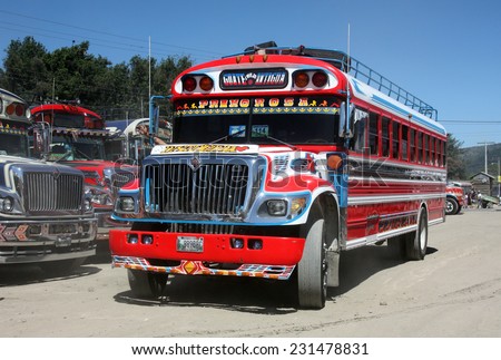 ANTIGUA, GUATEMALA - CIRCA OCTOBER 2012: Brightly decorated local buses (chicken buses) at city bus station