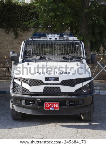 HEBRON, PALESTINE - CIRCA JUNE 2012:  Israeli armored police vehicle at security checkpoint in Hebron city center