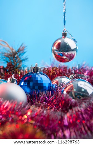 festive balls and toys for new year on the blue background