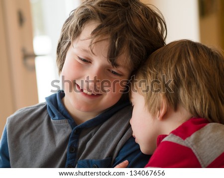 Two loving brothers hugging each other