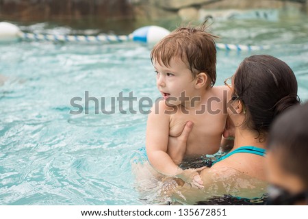 Family playing in the pool at Jay Peak's water park and resort