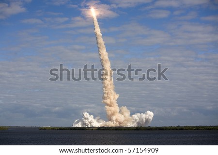 CAPE CANAVERAL, FL - NOV. 16: NASA Space Shuttle Atlantis moves through a cloud after a successful liftoff. on Nov. 16, 2009 at Cape Canaveral, Florida.