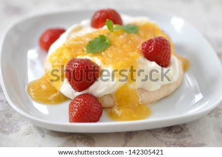 Pavlova Cake with cream and strrawberries
