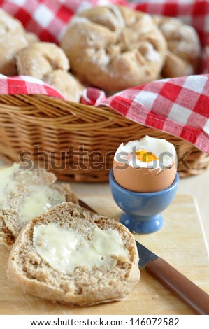 Bread Rolls and egg on a breakfast table