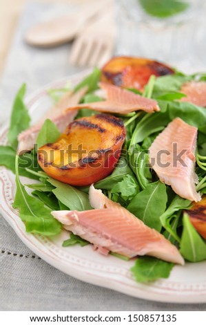 Healthy Salad with grilled Peach and smoked trout