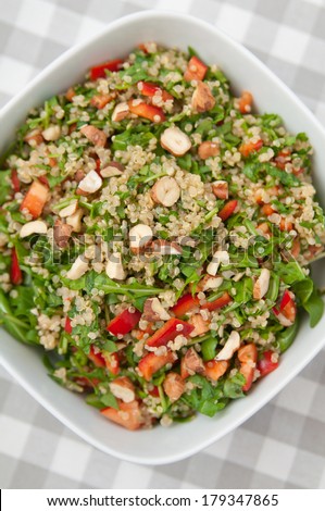 Organic Vegan Quinoa Salad with hazelnuts, arugula salad and red pepper
