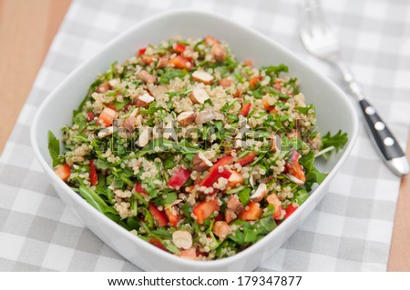 Organic Vegan Quinoa Salad with hazelnuts, arugula salad and red pepper