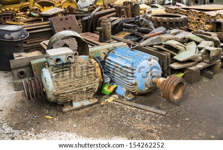 old rusty electric motors in junkyard