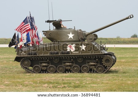CLEVELAND, OHIO - SEPT. 6:  A restored WWII Sherman tank with various flags on the rear at the Cleveland National Airshow on Sept. 6, 2009 in Cleveland, Ohio.