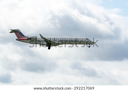 CLEVELAND, USA - JUNE 30, 2015: American Airlines American Eagle Bombardier CL-600-2C10 at Cleveland Hopkins International Airport.