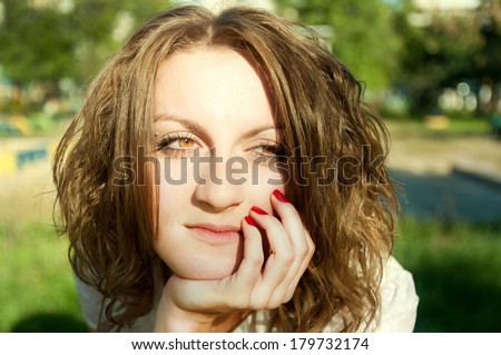 red-haired curly woman do not know what to do and thinking