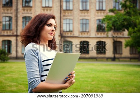 student girl on the university building background