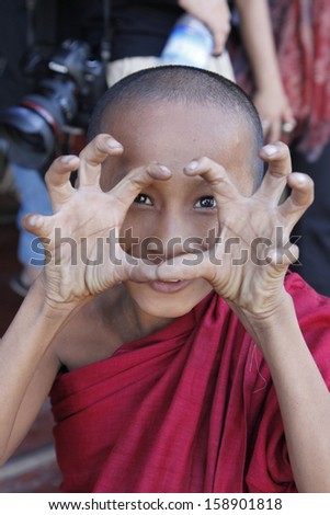 MRAUK U, MYANMAR - DECEMBER 12: An unidentified Burmese Buddhist novice on December 12, 2009 in Mandalay, Myanmar. In 2009 an ongoing conflict started between Buddhists and Muslims in Myanmar.
