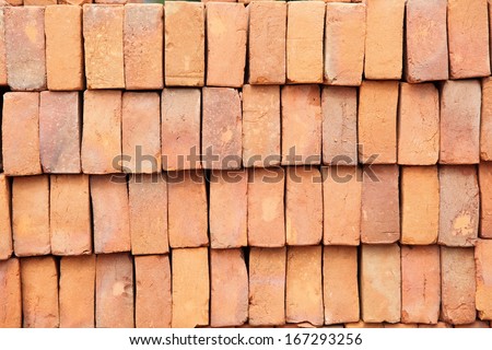 Wall or stack of red brick pavers at construction supply store