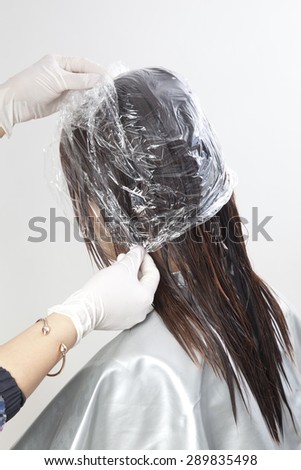 The process of hair coloring,hair coloring,Hair Colouring in process,Woman gets new hair colour,Hair Colouring in process,Hair plastic wrap,