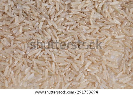 coarse rice or half polished rice background, uncooked raw cereals,