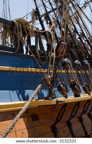 Ropes, Pulleys on the side of a wooden sailing ship