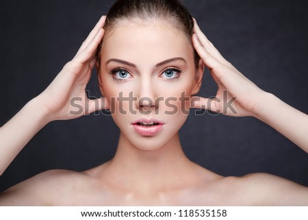 beautiful woman with hands on head