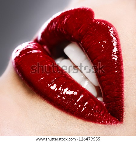 Beautiful Female With Red Shiny Lips Close Up