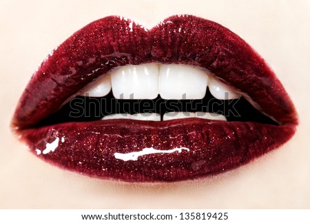 Beautiful red glossy lips close-up, macro photography