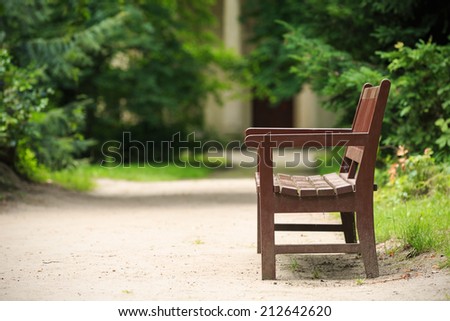 Wooden bench in the park in summer.Park Arkadia,Nieborow.