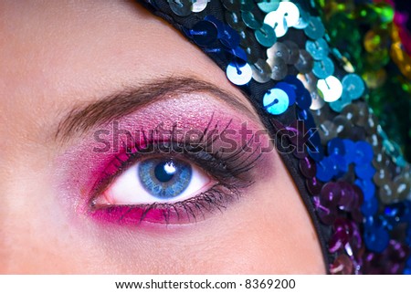 Detail shot of model with exquisite makeup and beautiful blue eye.