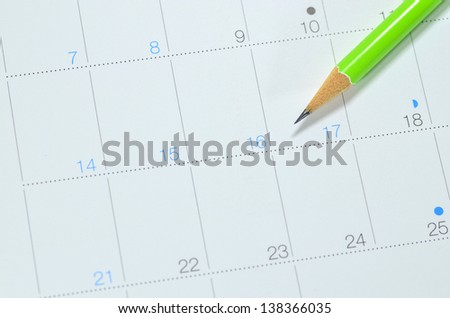 calendar with long holiday dates and pencil