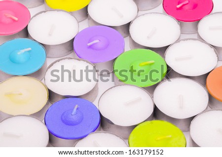 Colored Tealight Candle as background
