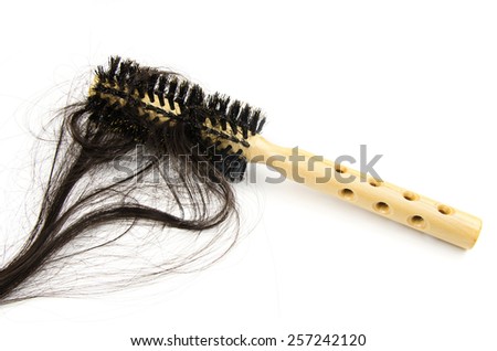 hair brush with lost hair on white background