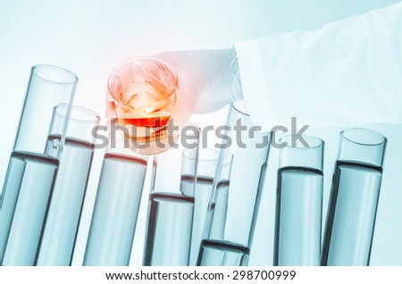 science laboratory test tubes in hand