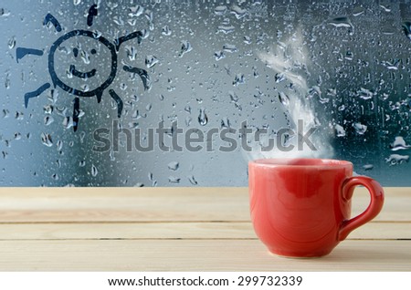 coffee cup with natural water drops on glass window background