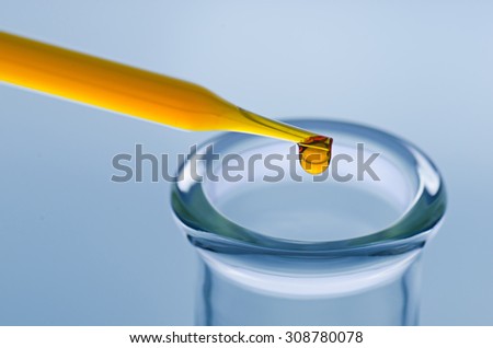 science laboratory pipette with drop