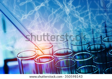 science laboratory test tubes with DNA sign background