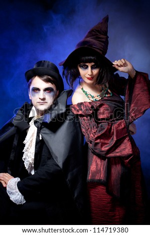 man and woman  wearing  as  vampire and witch. Halloween