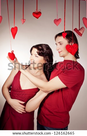Mature couple of lovers. Man presents flower