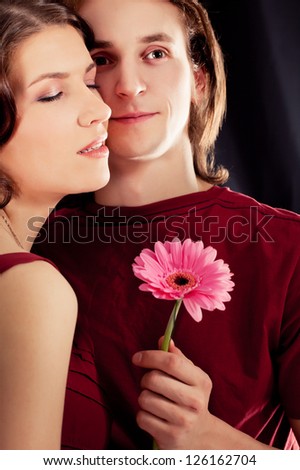 couple of lovers. Man presents flower
